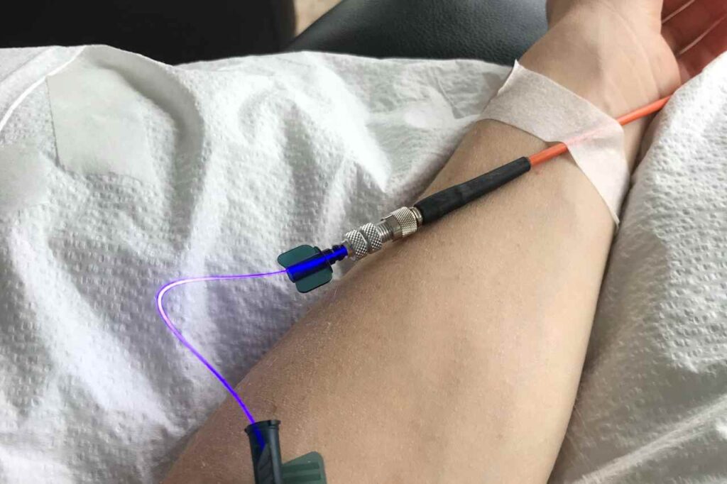 An IV drip in Danielle's arm, as she suffers from chronic health conditions.