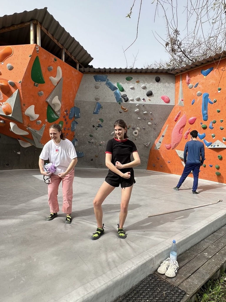 A picture of Ella, a DNRS patient, at an outdoor rock climbing gym.